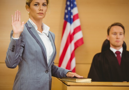 A woman swearing to uphold her oath in court, an HCH Expert Witness in Florida